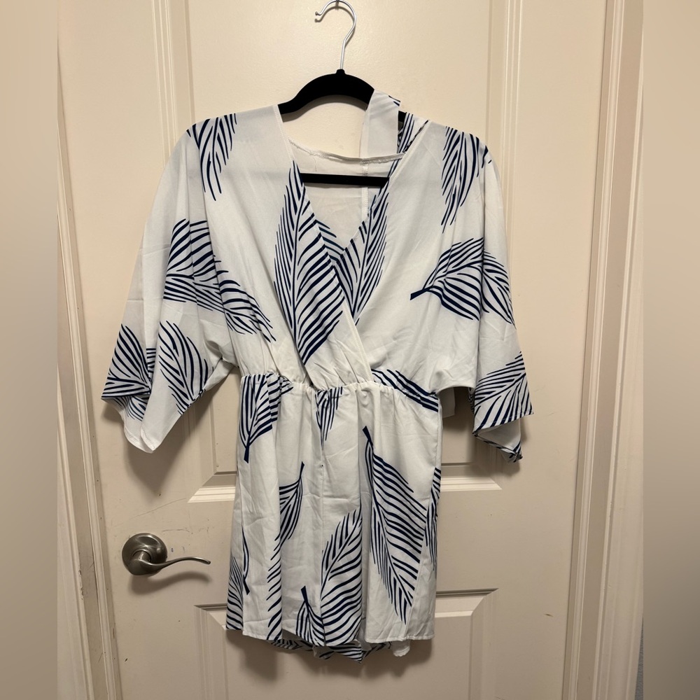 Women's romper. White with blue print and matching tie belt